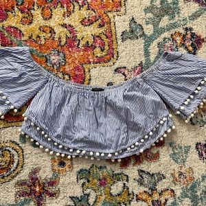 Fun off the shoulder crop top with pom poms